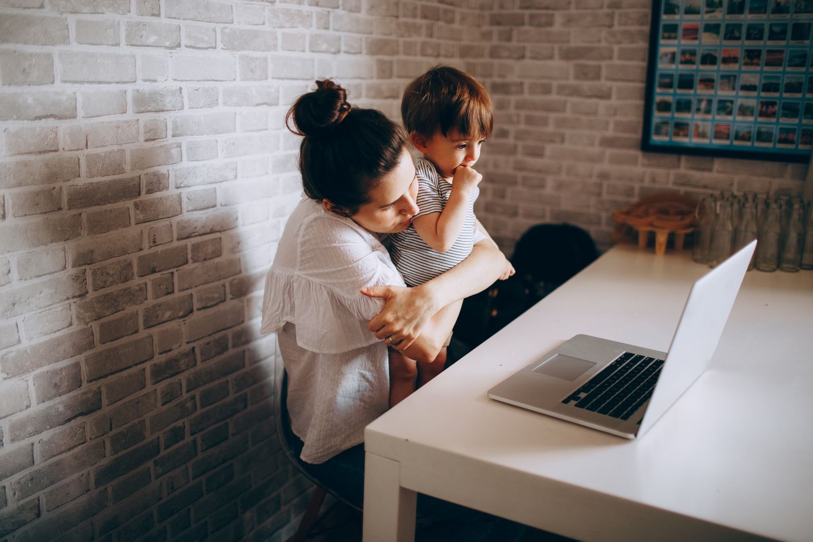 Mother and child video calling at home