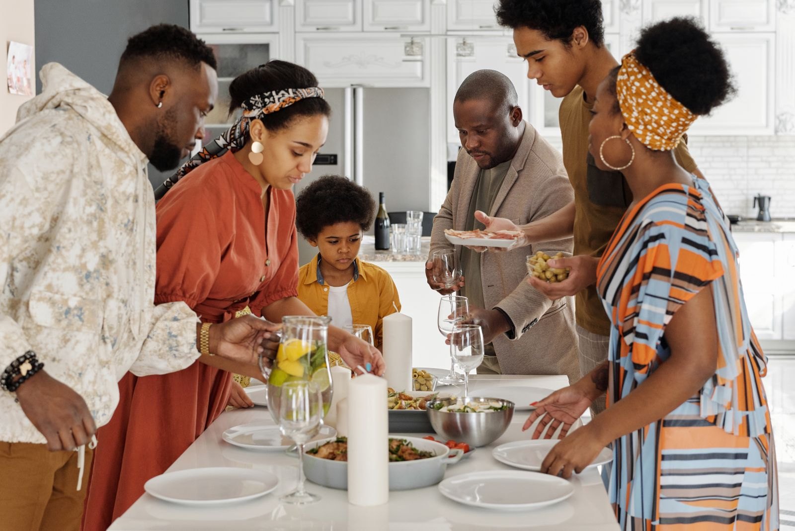Family setting the table for dinner