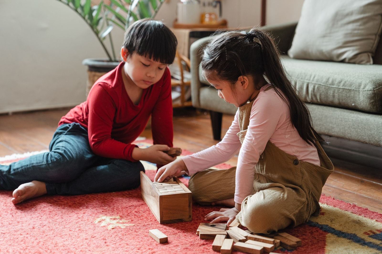 Photo of kids playing with wooden blocks