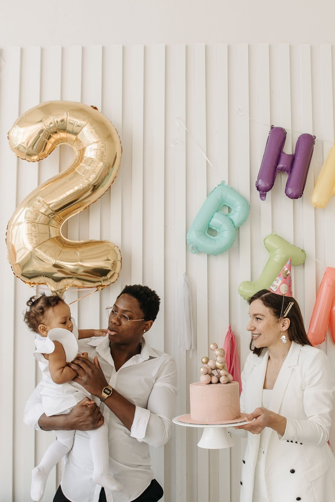 Parents celebrating their child s birthday at home