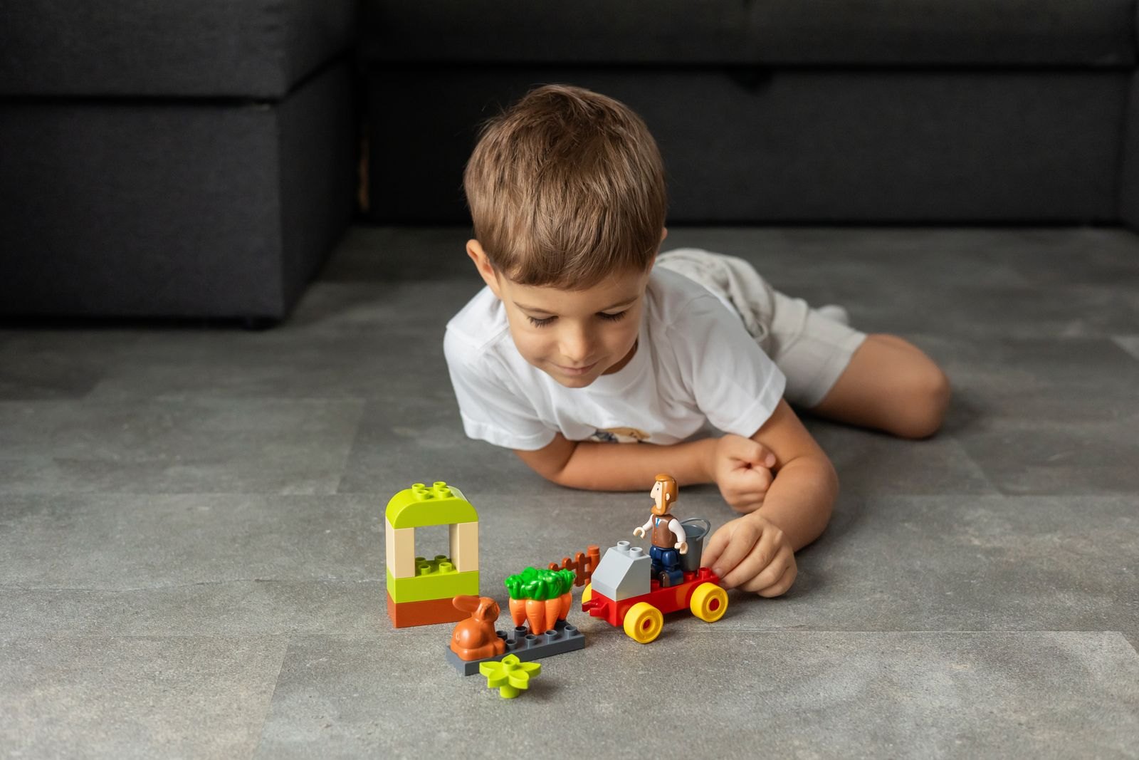 Child playing with colorful building blocks indoors