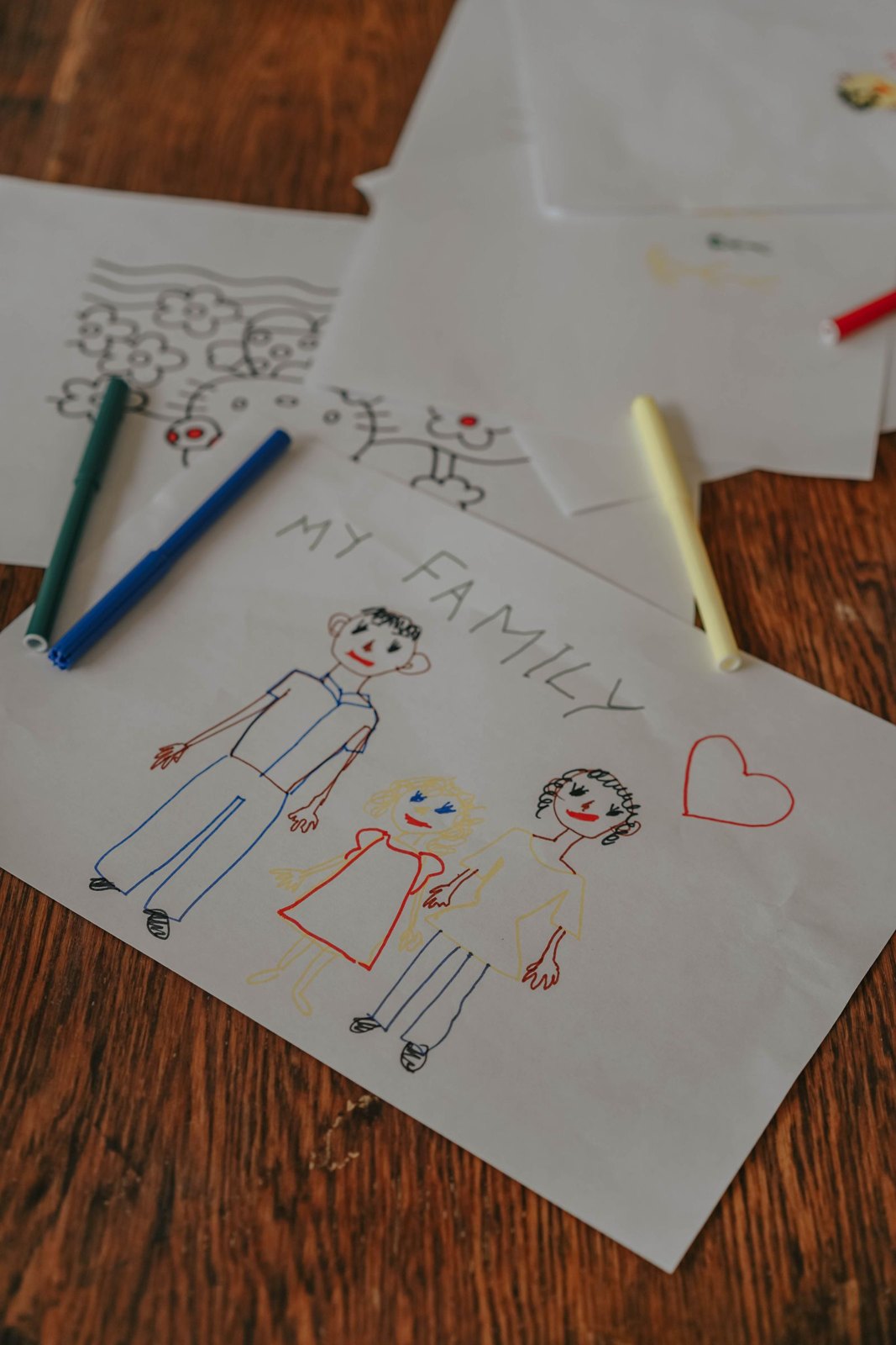 Child's drawing of a family on paper