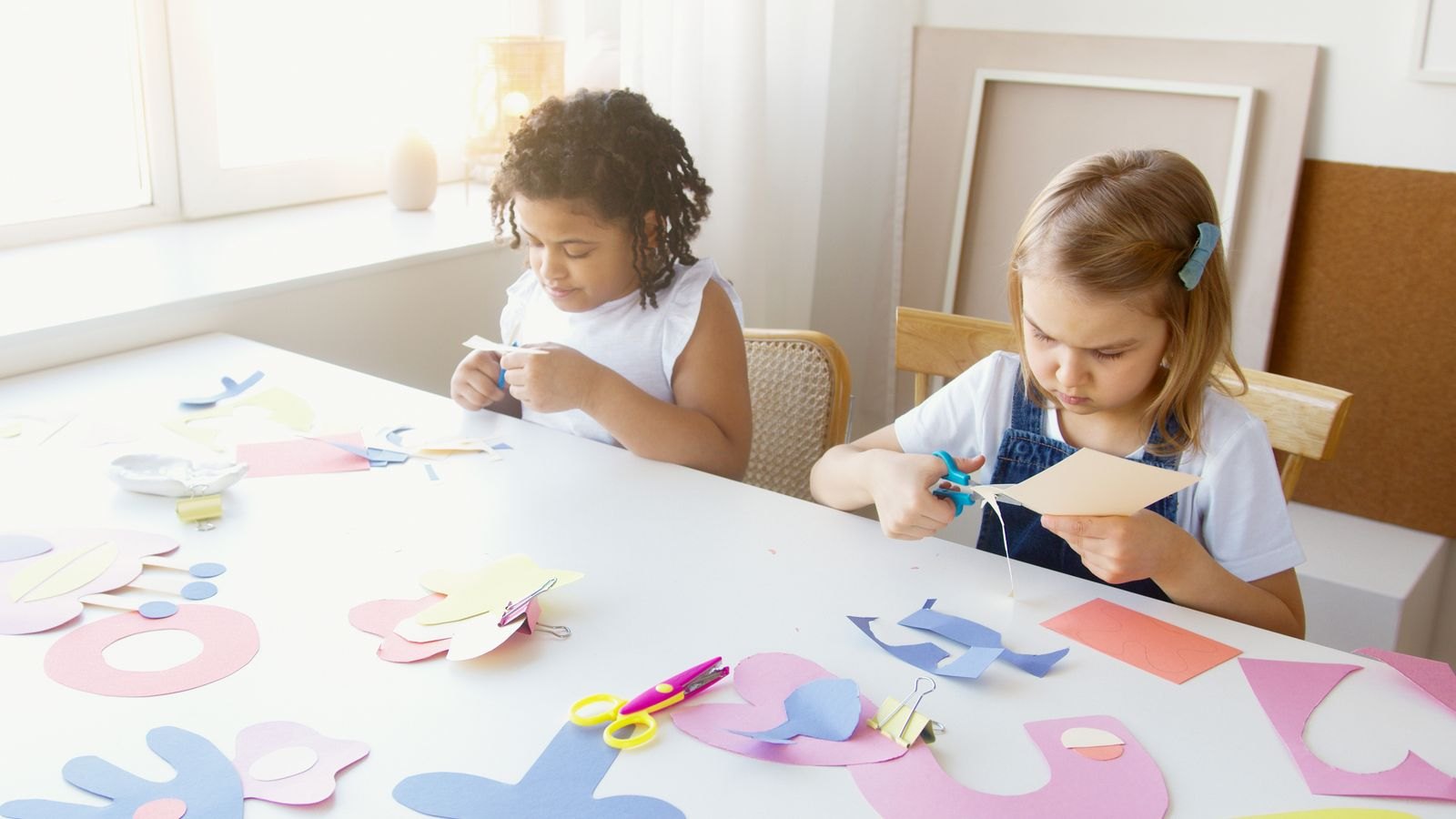 Two kids doing some artworks