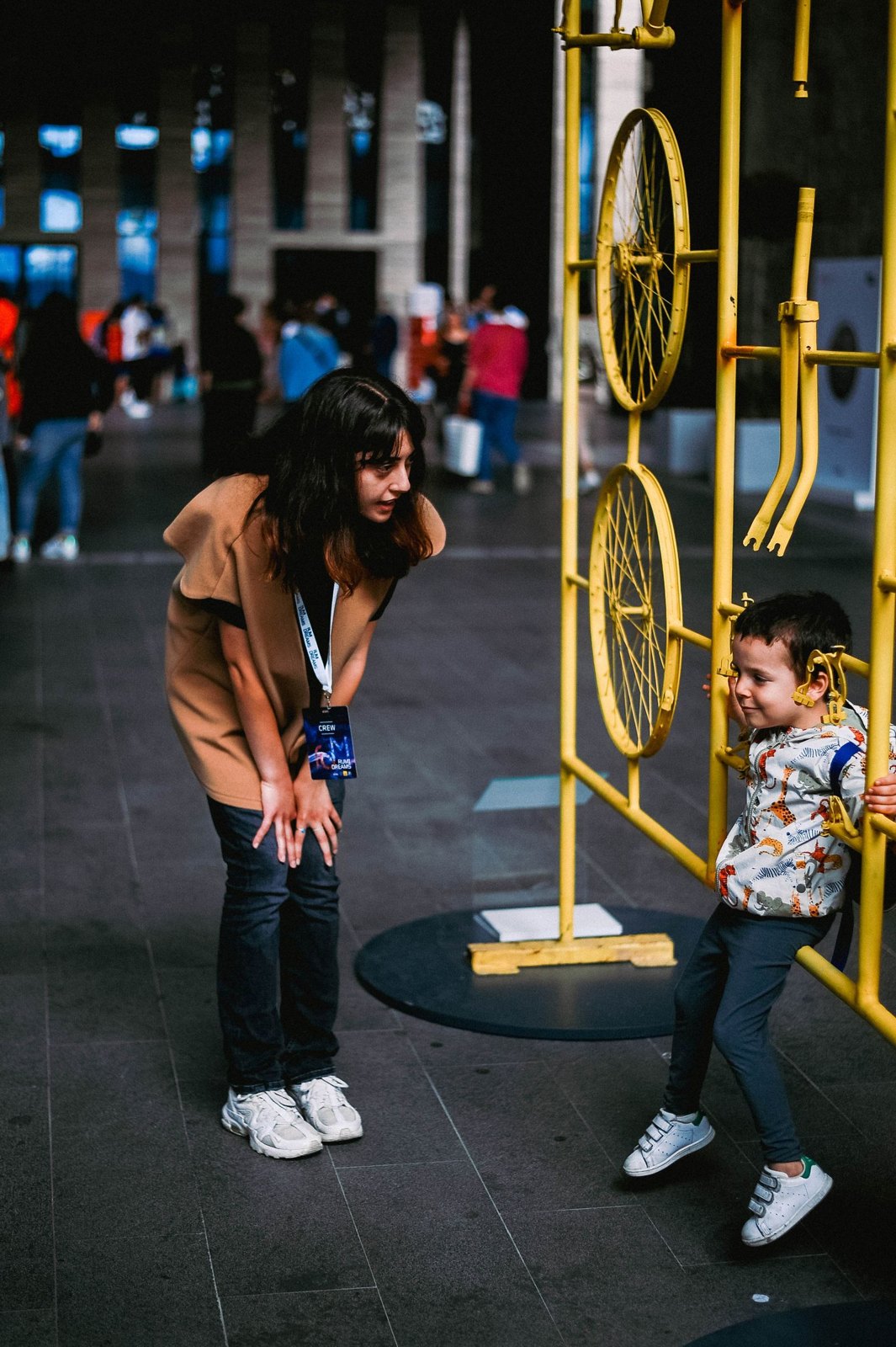 Woman and boy playing in museum